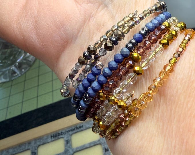 Gifts-Handmade separate memory wire bracelets-sold as set-sold individual-multi colored blue, silver, gold, clear and gray.