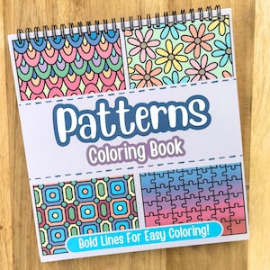 May include: A spiral-bound coloring book titled "Patterns Coloring Book" with four different pattern designs. The patterns include floral, geometric, and abstract shapes in various colors. The cover also includes the text "Bold Lines For Easy Coloring!"