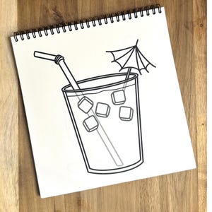 May include: A black and white line drawing of a glass of ice water with a straw and a spiderweb umbrella.