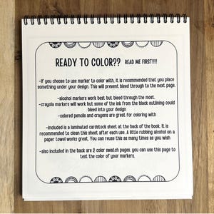 May include: A black and white page with instructions for coloring a book. The text reads "Ready to Color?? Read Me First!!!" and includes tips for using markers, crayons, and pencils. It also mentions a laminated cardstock sheet and color swatch pages included in the back of the book.