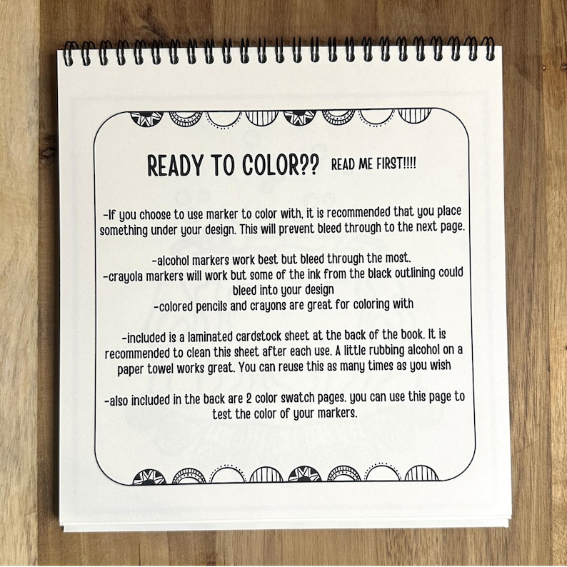 May include: A black and white page with instructions for coloring a book. The text reads "Ready to Color?? Read Me First!!!" and includes tips for using markers, crayons, and pencils. It also mentions a laminated cardstock sheet and color swatch pages included in the back of the book.