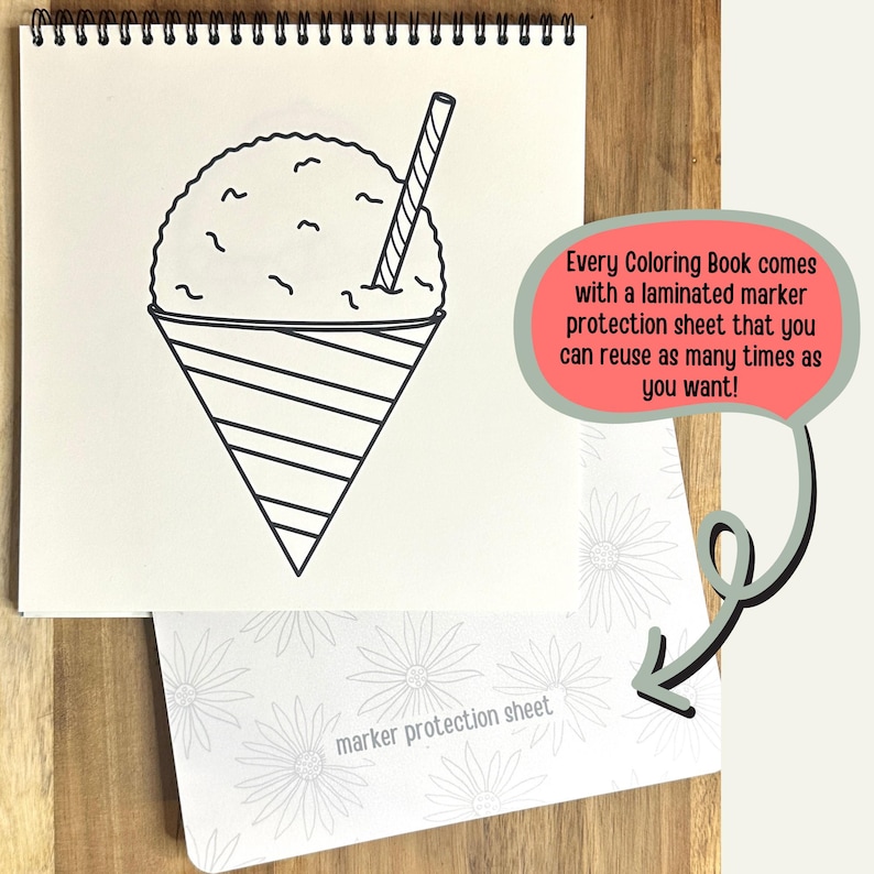 May include: A black and white line drawing of a snow cone in a cone with a straw. The image is on a white sheet of paper with a spiral binding. The text "Every Coloring Book comes with a laminated marker protection sheet that you can reuse as many times as you want!" is in a red speech bubble. A white sheet of paper with the text "marker protection sheet" is in the lower right corner of the image.