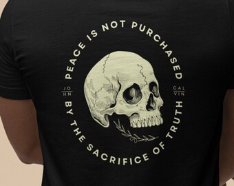 May include: Black t-shirt with a graphic print of a skull with a leaf branch and the text "Peace is not purchased by the sacrifice of truth".