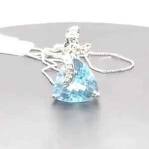 Sparkling 8 Carart Swiss Blue Topaz Pendant w/ an Equisite Trillant Cut & Small Diamond 14k White Gold Plating Over 925 Sterling Silver