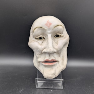 Vintage ansiktsmaskskulptur – Uttrycksfull väggkonst