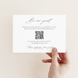 May include: A white card with black text that says "Be our guest". The card includes a QR code and the text "Please scan the QR code with your smartphone for more details and to RSVP www.ourweddingwebsite.com". The card also includes the text "You can also reply via mail or email to address@weddingmail.com" and "Please reply by Jane first".