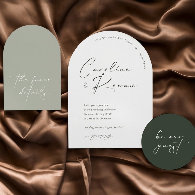 May include: Wedding invitation suite with a sage green and white color scheme. The invitation features a rounded arch shape with the names "Caroline & Rowan" in cursive script. The text "True love stories never have endings." is printed in a smaller font below the names. The RSVP card features the text "The finer details" in a white cursive script on a sage green background. The save the date card features the text "be our guest" in a white cursive script on a dark green background.