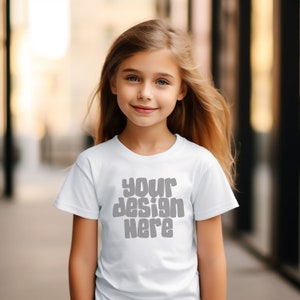 May include: A white t-shirt with the text "your design here" in gray letters.