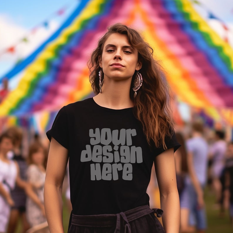 May include: A woman wearing a black t-shirt with the text "your design here" in a retro font. She is standing in front of a colorful rainbow background.
