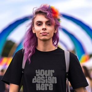 May include: A person with purple and rainbow hair wearing a black t-shirt with the text "your design here" printed on the front.