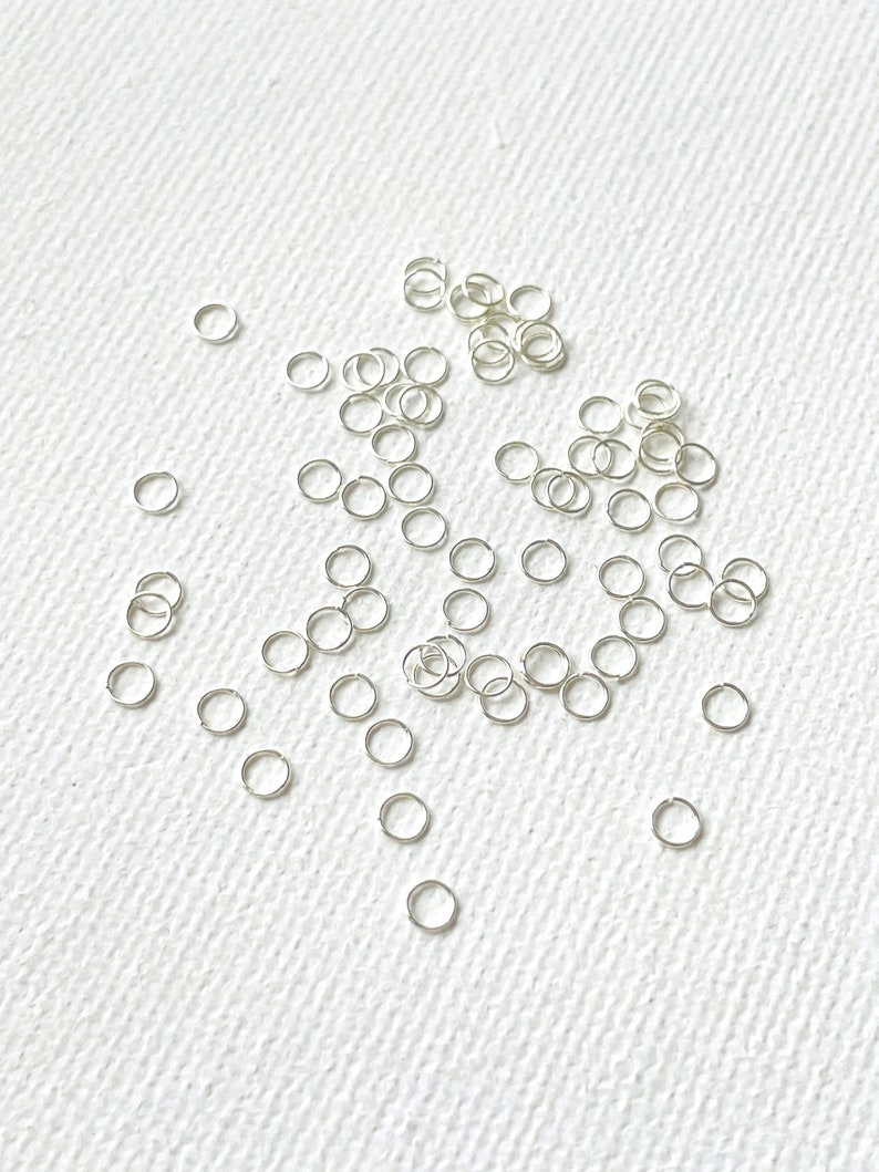 Extra Dünne Versilberte Edelstahl Ösen 3mm x 0.3mm / 100Stk Bild 1