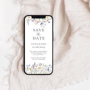 May include: A save the date card with a floral border. The text reads "Save the Date, Laura & Janis, 21.08.2025. Wir sagen ja und m&ouml;chten diesen besonderen Tag mit euch feiern. Weitere Details folgen mit der Einladung."