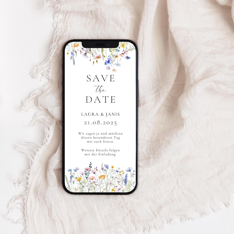 May include: A save the date card with a floral border. The text reads "Save the Date, Laura & Janis, 21.08.2025. Wir sagen ja und m&ouml;chten diesen besonderen Tag mit euch feiern. Weitere Details folgen mit der Einladung."