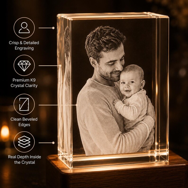 May include: A rectangular K9 crystal block featuring a 3D laser-engraved portrait of an adult holding a baby. The crystal has beveled edges and sits on a wooden base. Text labels include Crisp & Detailed Engraving, Premium K9 Crystal Clarity, Clean Beveled Edges, and Real Depth Inside the Crystal.
