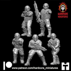 May include: Five grey plastic miniature figures of soldiers holding weapons. The figures are posed in a variety of action stances. The figures are standing on a black background. The text "HARDCORE MINIATURES" is printed in red and white on a red and yellow flame design.
