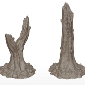 May include: A collection of six gray, miniature dead trees with textured bark and detailed bases. The text "DEAD TREES" is printed in a bold, stylized font above the trees. These trees are suitable for tabletop gaming or model scenery.