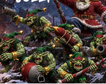 May include: A group of green-skinned orc miniatures dressed as Santa and elves, with the text 'TIS THE SEASON TO BE JOLLY'. The figures hold various items including a pistol, a rocket, a large ball, and a candy cane-striped staff.