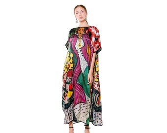 May include: A long, colorful, abstract print dress with a loose fit and short sleeves. The dress features a variety of colors, including red, green, yellow, and purple. The print is reminiscent of a painting.
