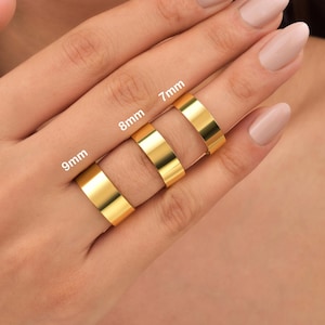 May include: Three gold rings of different widths, labeled 7mm, 8mm, and 9mm.