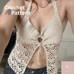 May include: A beige crochet halter top featuring a central ring detail with tie closures and an intricate openwork lace pattern throughout the bodice. The text "Crochet Pattern" is visible in the upper left corner of the image.