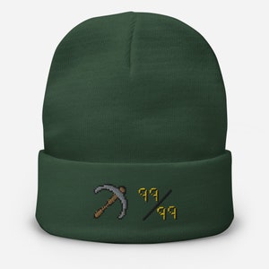 May include: A dark green beanie with a gray pickaxe and the text "99/99" embroidered on the front.