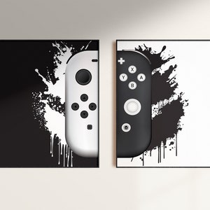 May include: Two black and white images of a video game controller with a white and black splatter paint background.