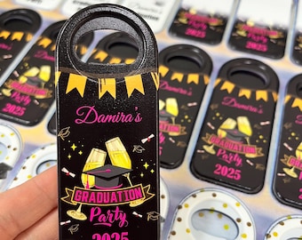 May include: Black bottle opener with a gold and black graduation party design. The design includes a graduation cap, champagne glasses, and the text "Damira's Graduation Party 2025".