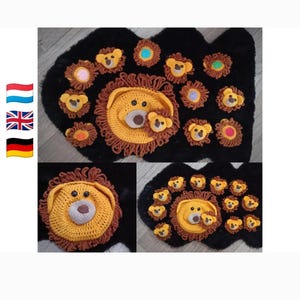 May include: A collection of crocheted lion-themed appliques featuring a large central lion face with a brown mane and smaller circular lion motifs in various colors, all arranged on a black textured surface with three national flag icons.