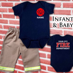 May include: Infant and baby firefighter-themed outfit set. Includes a navy blue bodysuit with a red firefighter emblem and space for a name, a second navy blue bodysuit with "YOUR CITY FIRE DEPARTMENT" text, and tan pants with reflective stripes.