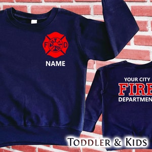 May include: Navy blue toddler and kids sweatshirts with a red firefighter logo and the text "YOUR CITY FIRE DEPARTMENT" on the back. The front sweatshirt has a red firefighter logo and the text "NAME".