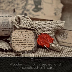 a wooden box with sealed and personalized gift cards