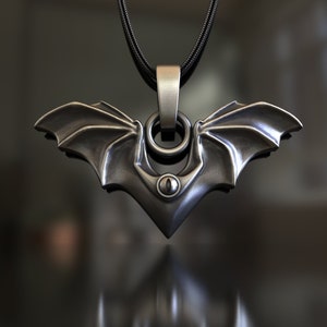 Bat-X shaped pendant