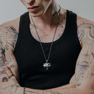 Sterling silver Cat School pendant with angular wolf face and fierce expression