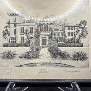 May include: Framed black and white architectural print of a large house with a tower, windows, and landscaping. The print is titled "Prospect, The Home of Woodrow Wilson" and is signed by Richard V. Borning.