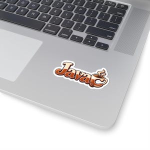 May include: A die-cut sticker featuring the word Java in a stylized brown and cream gradient font. The letter v is replaced by a steaming coffee cup graphic with a small coffee bean placed at the base, all outlined in a thick white border.