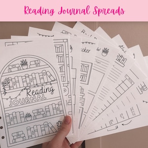 May include: A set of white paper reading journal inserts with black line art illustrations. The pages feature bookshelf designs, book trackers, and reading logs with text including Reading Journal. The sheets have punched holes for binding.