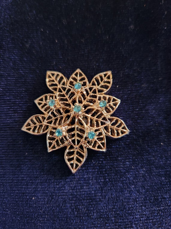 Vintage green and gold snowflake brooch - image 1