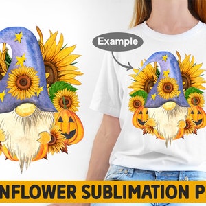 May include: A watercolor illustration of a gnome wearing a blue hat with stars and holding a sunflower. The gnome is surrounded by sunflowers, pumpkins, and leaves. The image is labeled "Sunflower Sublimation PNG".