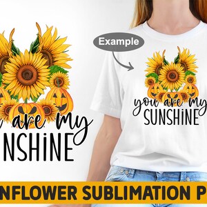 May include: Sublimation design featuring a cluster of sunflowers with jack-o'-lantern faces and the text "you are my sunshine".