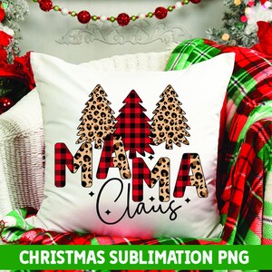 May include: White cushion with a red and black buffalo check Christmas tree and leopard print Christmas trees. The text "Mama Claus" is written in red and black buffalo check and leopard print.