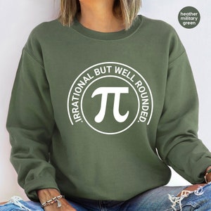 May include: A green sweatshirt with a white circle graphic that says "Irrational But Well Rounded" with a white pi symbol inside the circle.