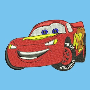 May include: Red cartoon race car with a smiling face and the words "Lightning McQueen" and "Year" on the tire.