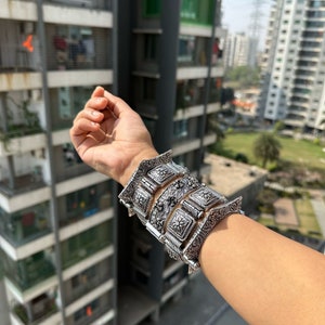 May include: A set of three ceramic mugs with a speckled, matte finish. The mugs are in shades of cream, light gray, and dark gray. Each mug has a simple, minimalist design, perfect for coffee or tea.