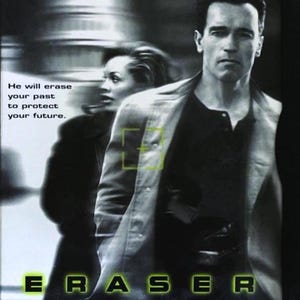 May include: A DVD cover featuring Arnold Schwarzenegger in a black jacket and white shirt, with the title "ERASER" in green letters. The text "He will erase your past to protect your future." is also visible. The background is a blurred image of a city street.