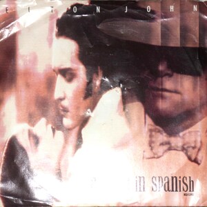 A Word In Spanish/Heavy Traffic (Vinyl, 7&quot;, 45 RPM, Single, Pinckneyville Pressing, US, Sep 1988)