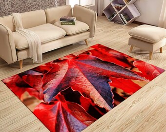 May include: Red and purple autumn leaves on a brown background. The leaves are arranged in a pattern that creates a sense of depth and texture. This is a rug with a leaf design.