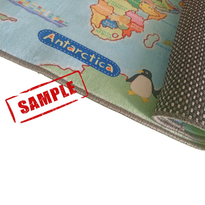 May include: A children's world map rug with a light blue background and colorful continents. The word "Antarctica" is in a blue bubble. A cartoon penguin is on the rug. The word "SAMPLE" is stamped in red.