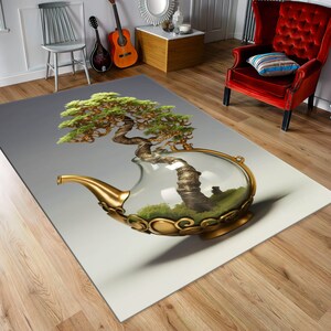 May include: A decorative rug with a green bonsai tree in a glass teapot. The teapot is gold with intricate details and the tree is surrounded by green moss.