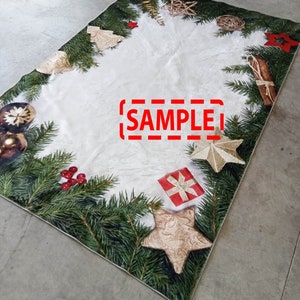 May include: Rectangular Christmas-themed rug with a white center and a border of green pine needles, ornaments, and festive decorations. The rug features gold stars, red berries, and a gift box. The word "SAMPLE" is printed on the rug.