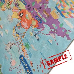 May include: A colorful children's world map rug featuring continents and oceans in various colors. The map includes illustrations of animals, landmarks, and the word "SAMPLE" stamped in red.